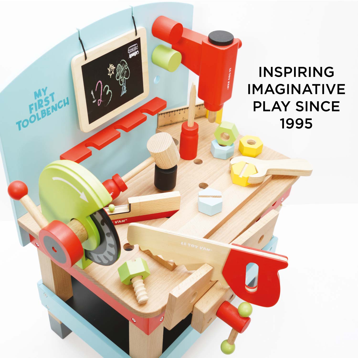 Children's toy workbench with various tools and a chalkboard, inspired by imaginative play since 1995.