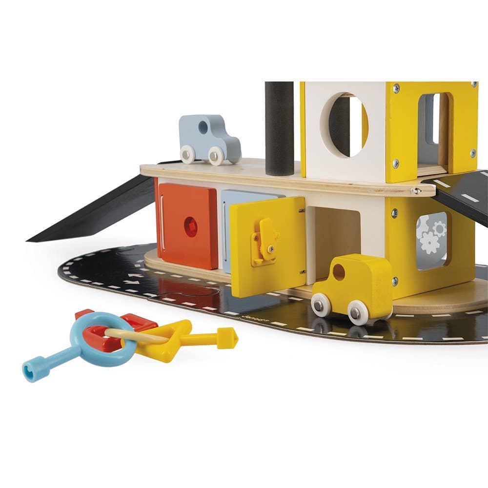 Children's toy set with wooden structure, doors, and small cars on a white background