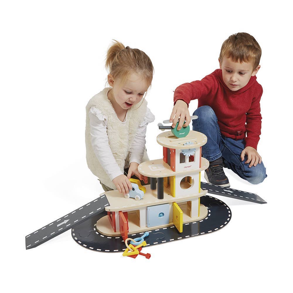 Two children playing with a wooden toy set on a white background