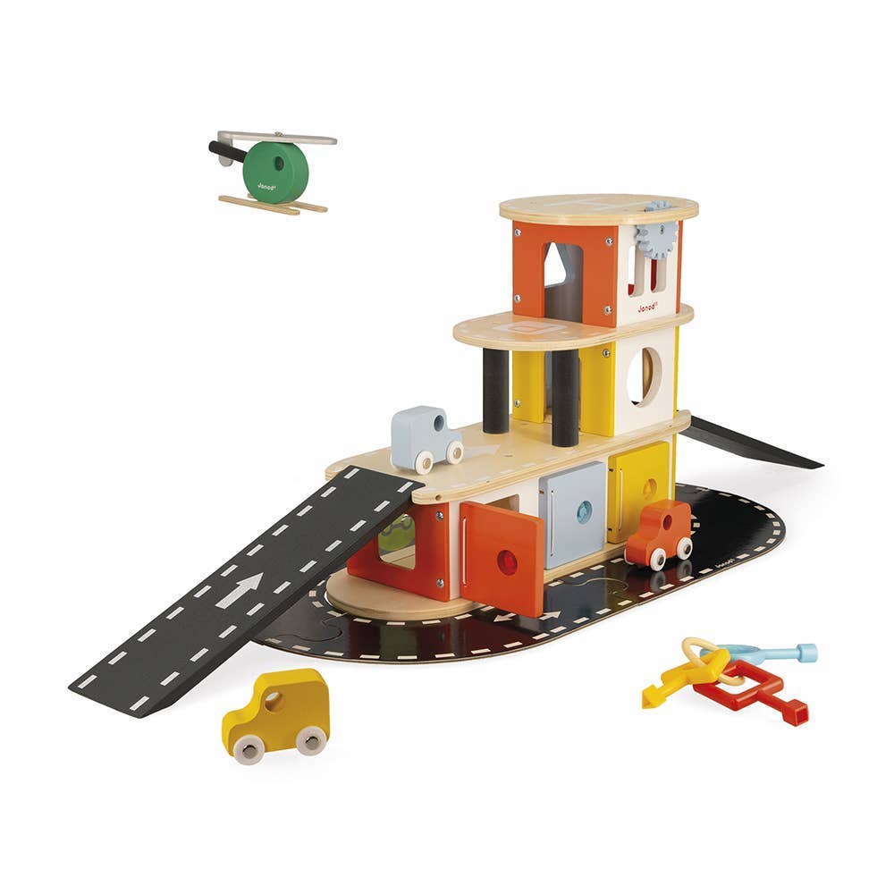 Wooden toy garage with cars and accessories on a white background