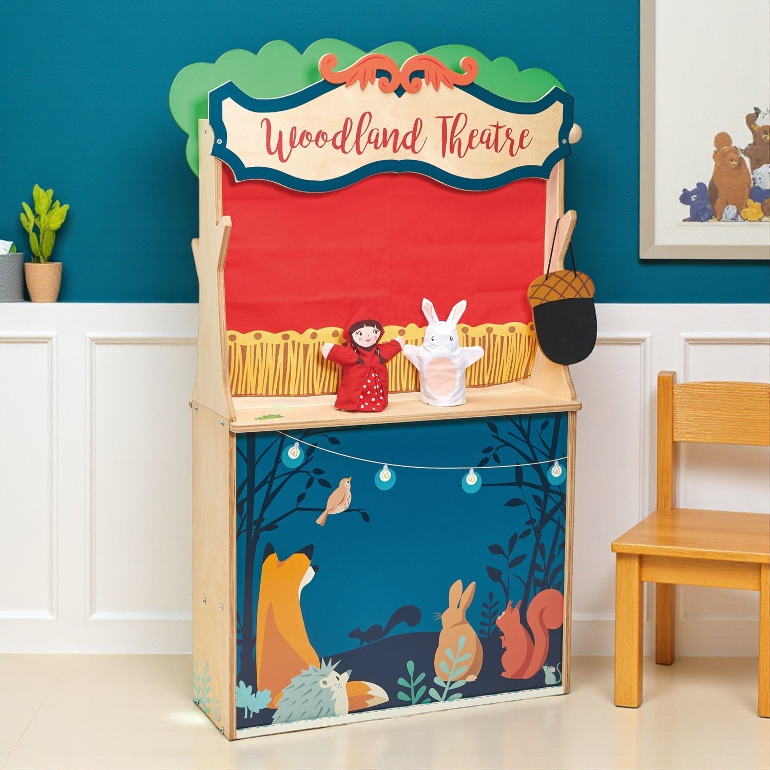 Woodland themed puppet theatre with characters on a blue wall background